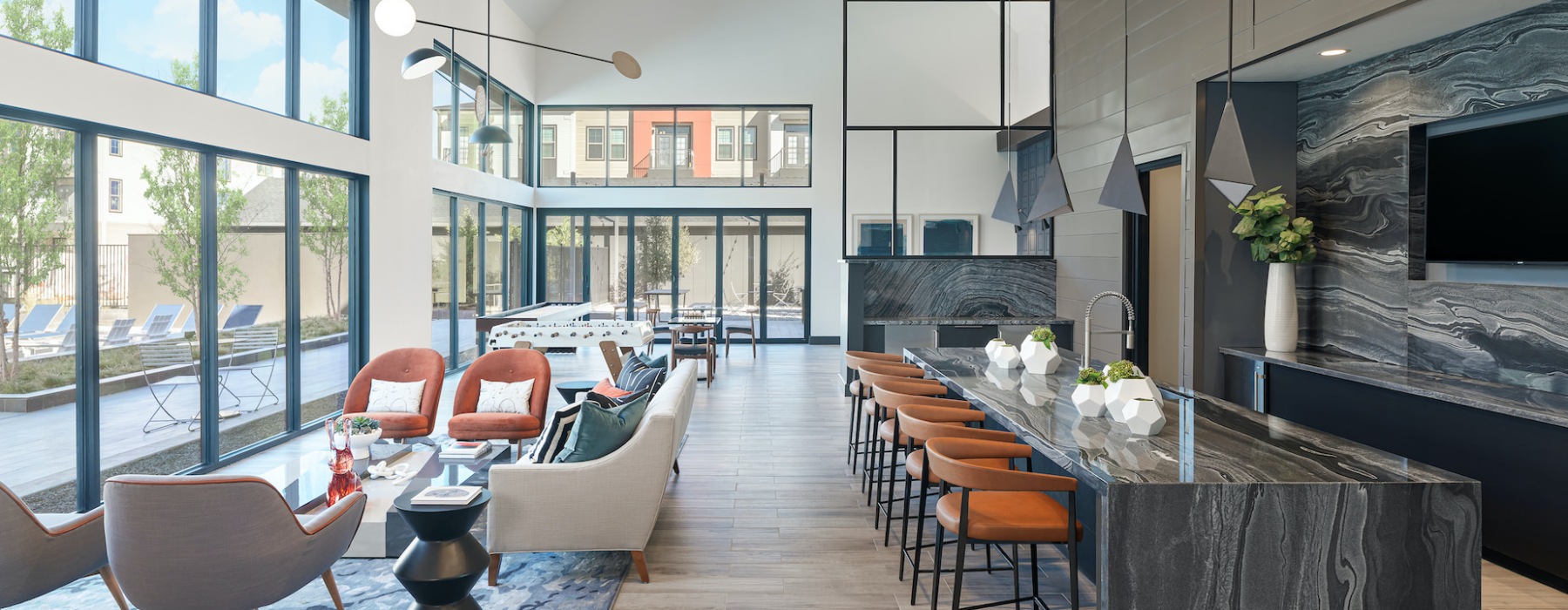 clubhouse area with seating and large windows